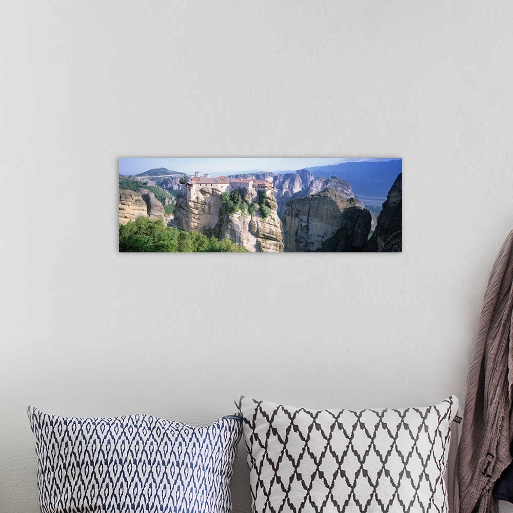 A bohemian room featuring Greece, Meteora, building on cliffs by sea