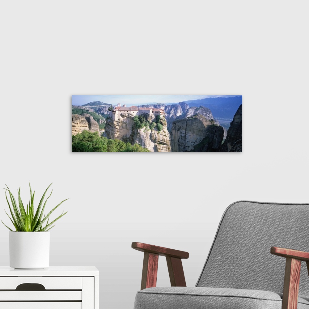 A modern room featuring Greece, Meteora, building on cliffs by sea
