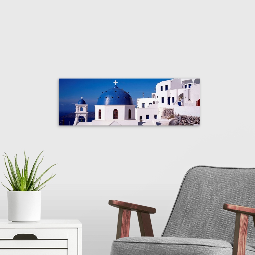 A modern room featuring Greece, Santorini, Fira, Church of Anastasis, Blue dome on a Church