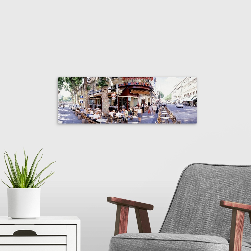 A modern room featuring Group of people at a sidewalk cafe Paris France