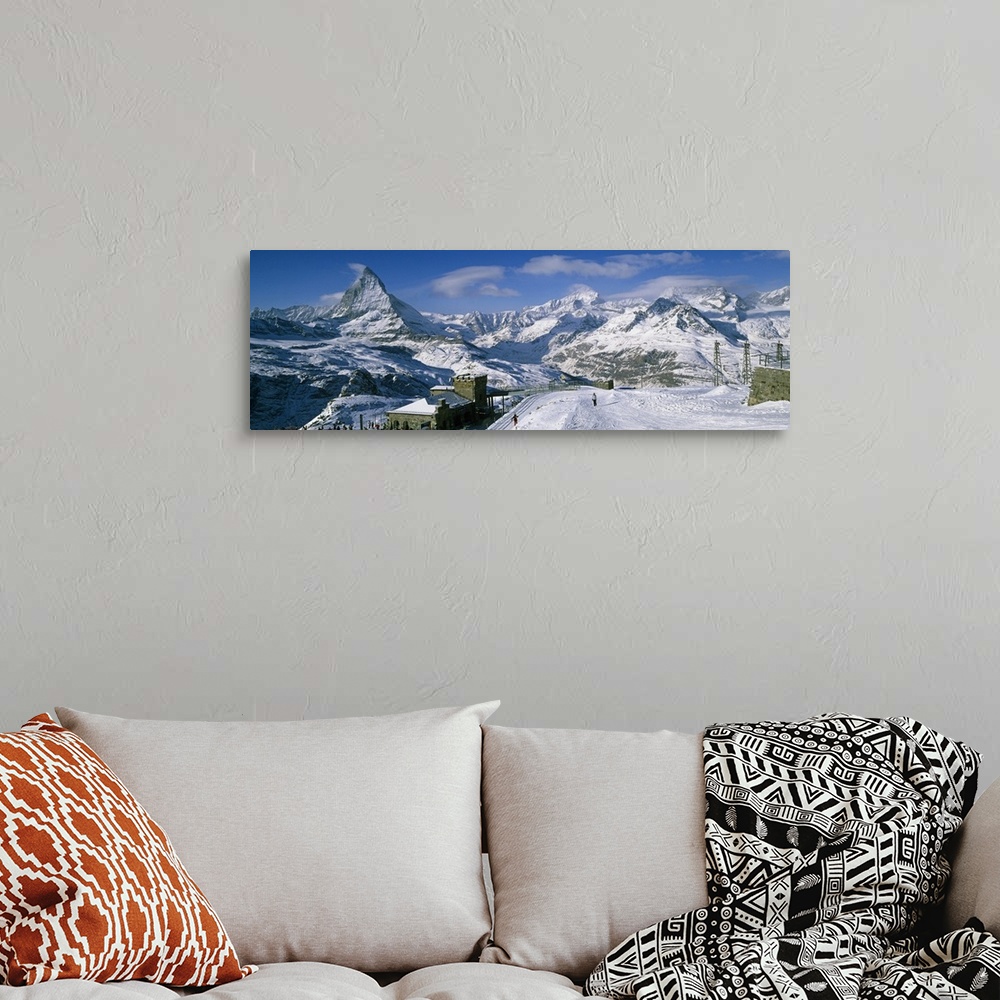 A bohemian room featuring Group of people skiing near a mountain, Matterhorn, Switzerland