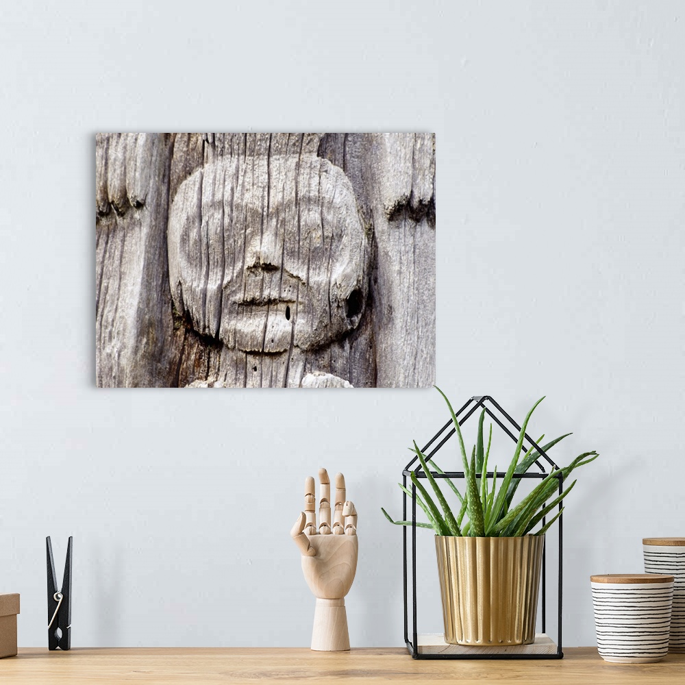 A bohemian room featuring Haida Gwaii totem pole detail, Queen Charlotte Island, British Columbia, Canada.