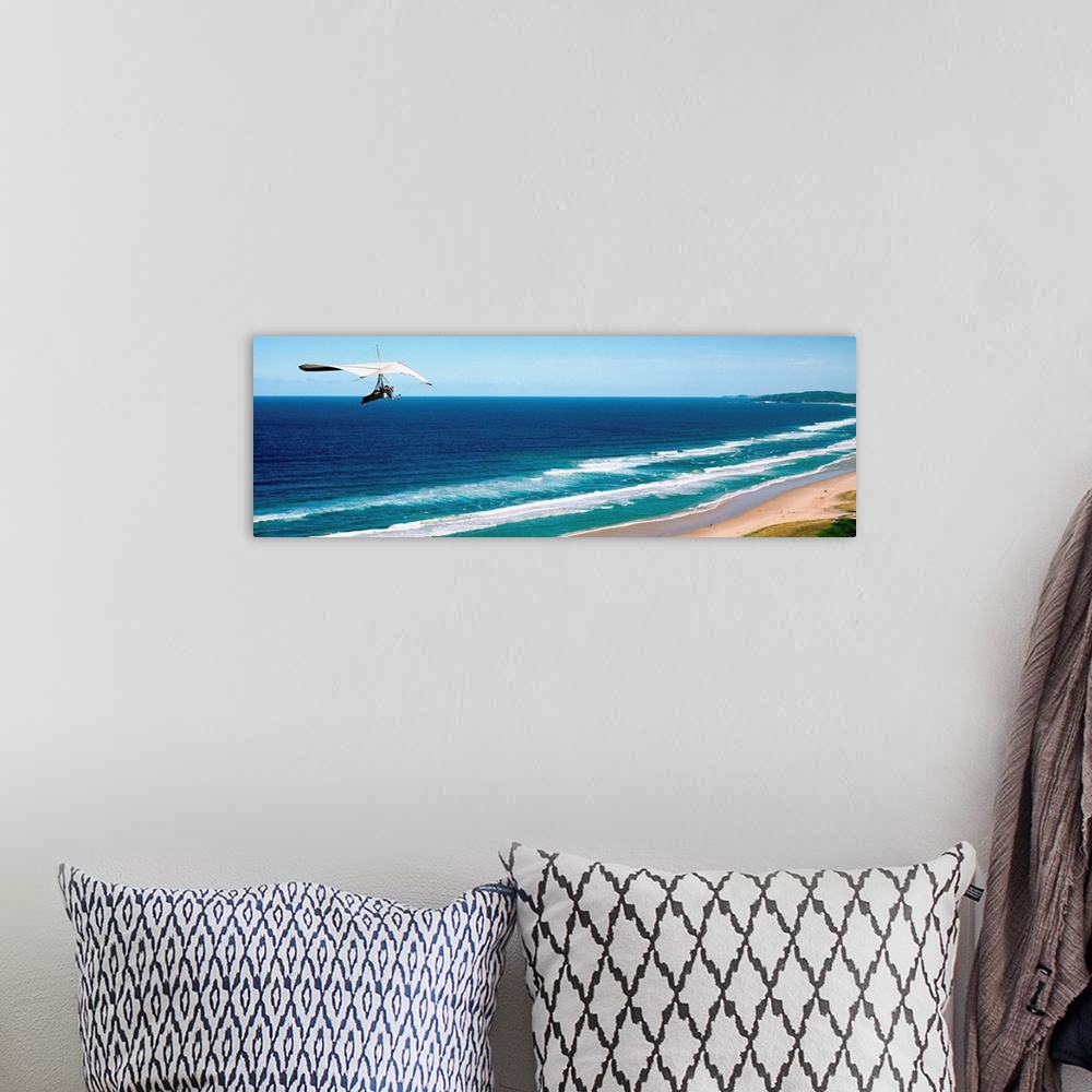 A bohemian room featuring Hang glider over the sea