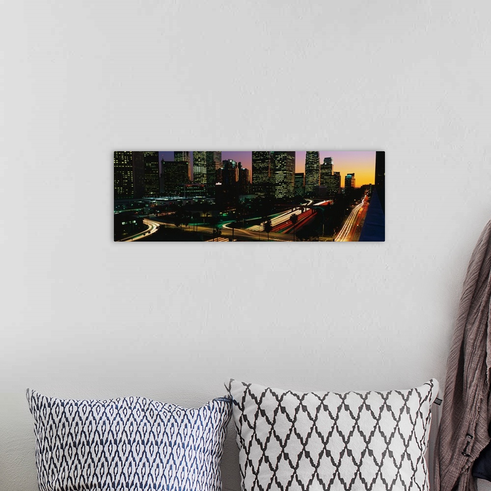 A bohemian room featuring This panoramic photograph of the city roadways was taken with the time lapsed photography techniq...