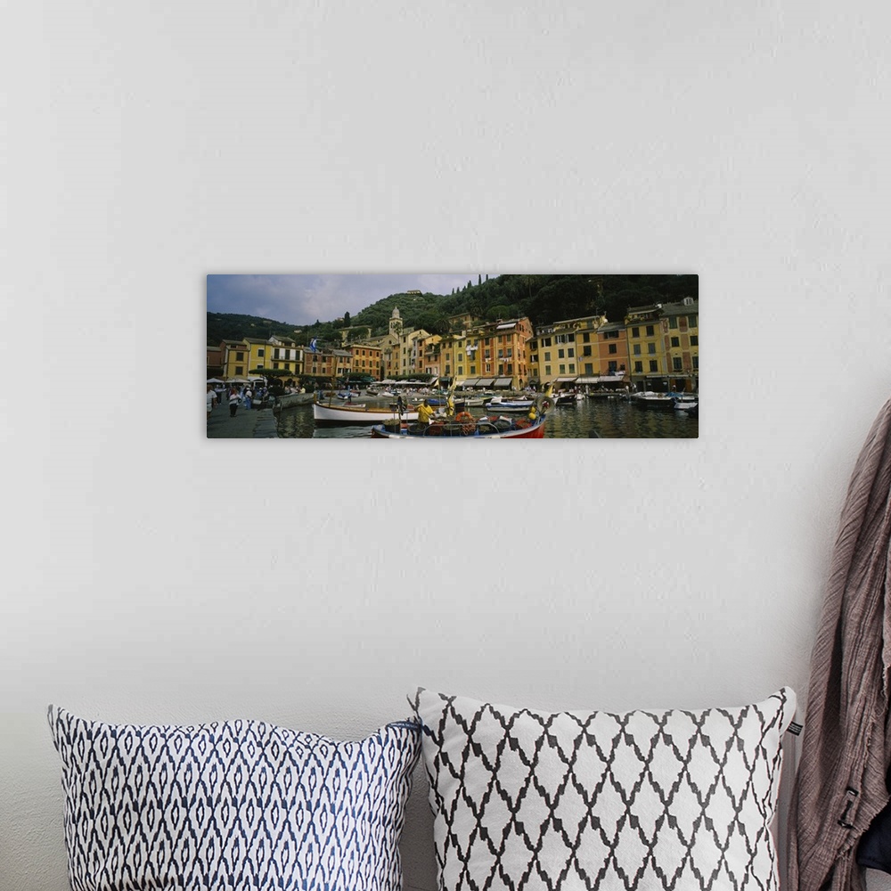 A bohemian room featuring Panoramic canvas of an Italian boat harbor with a bunch of boats and buildings meeting the water ...