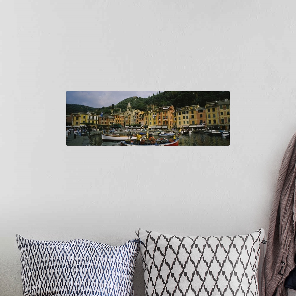 A bohemian room featuring Panoramic canvas of an Italian boat harbor with a bunch of boats and buildings meeting the water ...