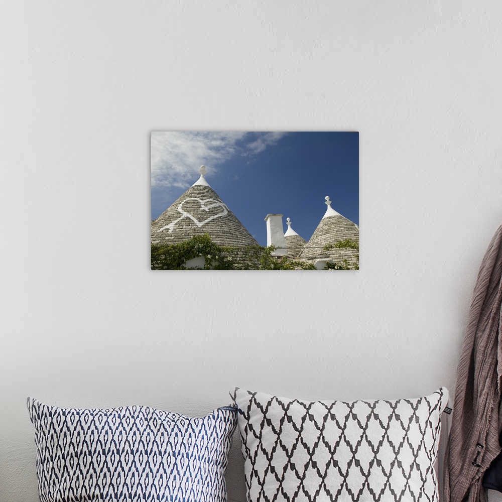 A bohemian room featuring Heart sign on the roof of a house, Trulli House, Alberobello, Apulia, Italy