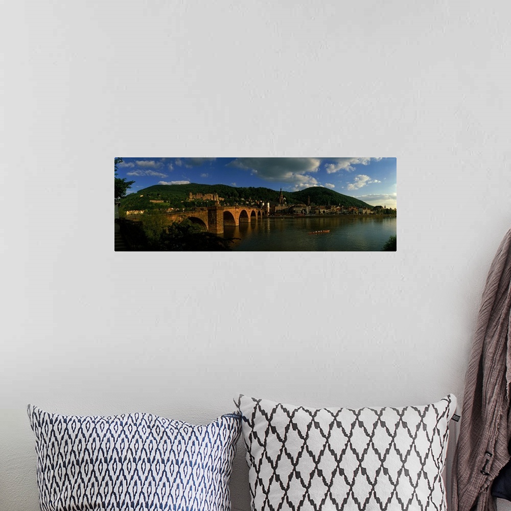 A bohemian room featuring Panoramic photo on canvas of an old stone bridge entering a German city along the waterfront.