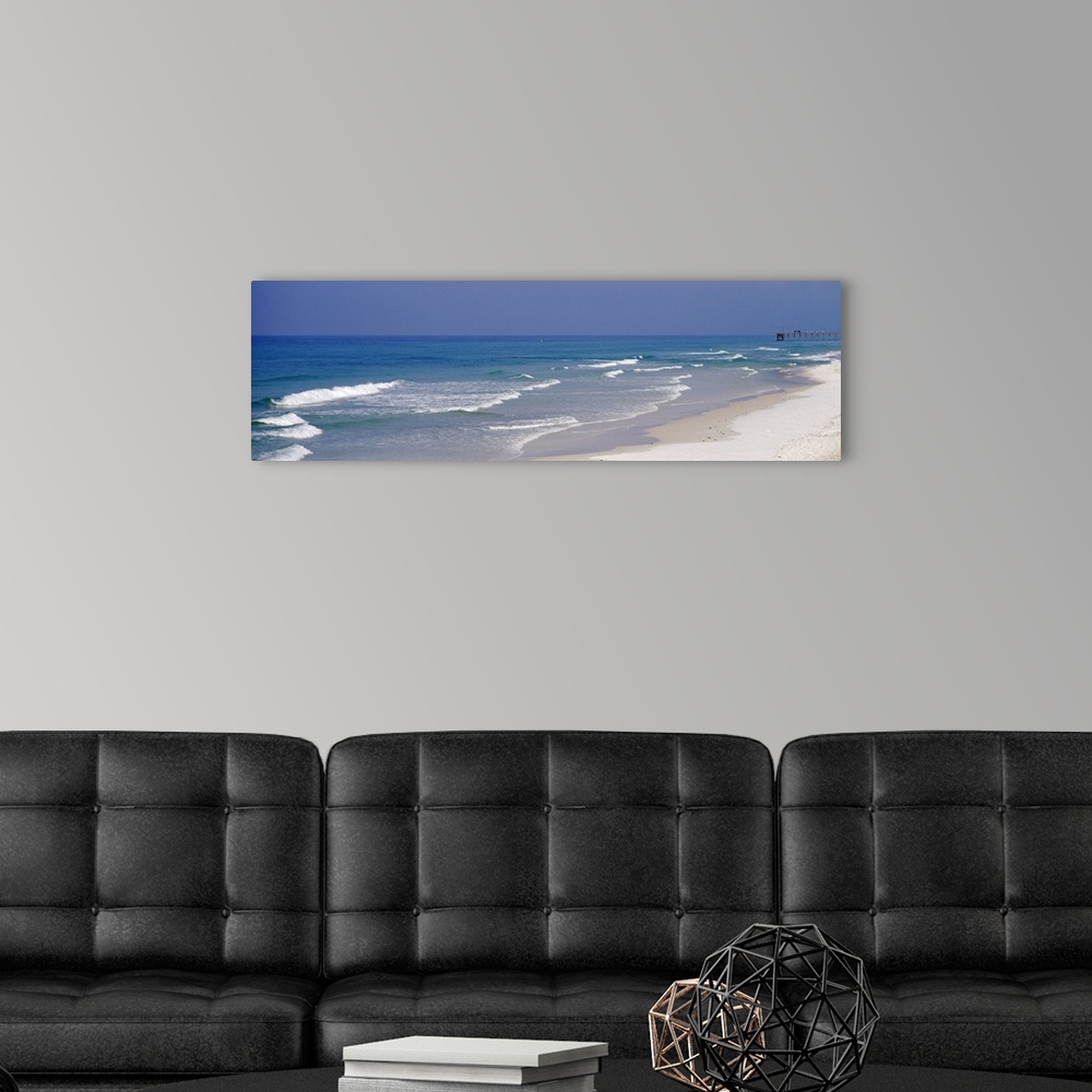 A modern room featuring Panoramic photo of waves rushing onto the sandy shoreline in Florida, on the coast of the Atlanti...
