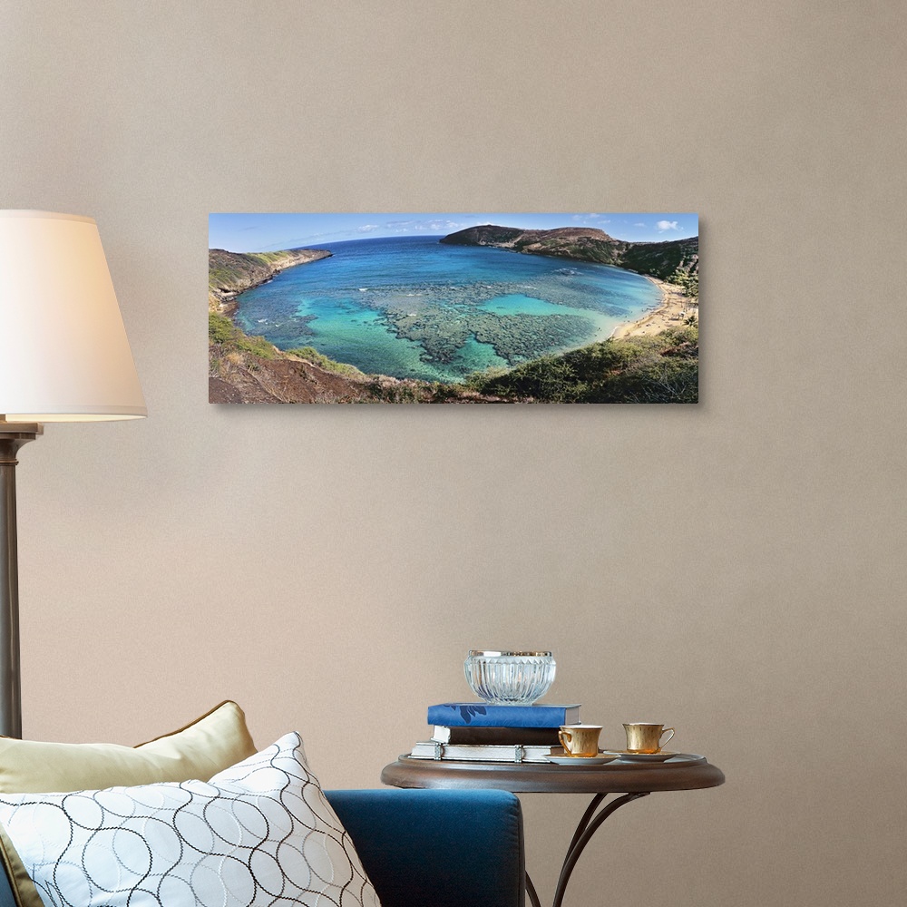 A traditional room featuring Panoramic photograph of gulf surrounded by beach and mountainsides.