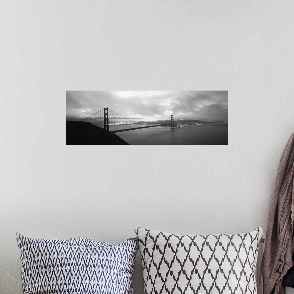 A bohemian room featuring Giant black and white photograph of the Golden Gate Bridge in San Francisco, California (CA) on a...