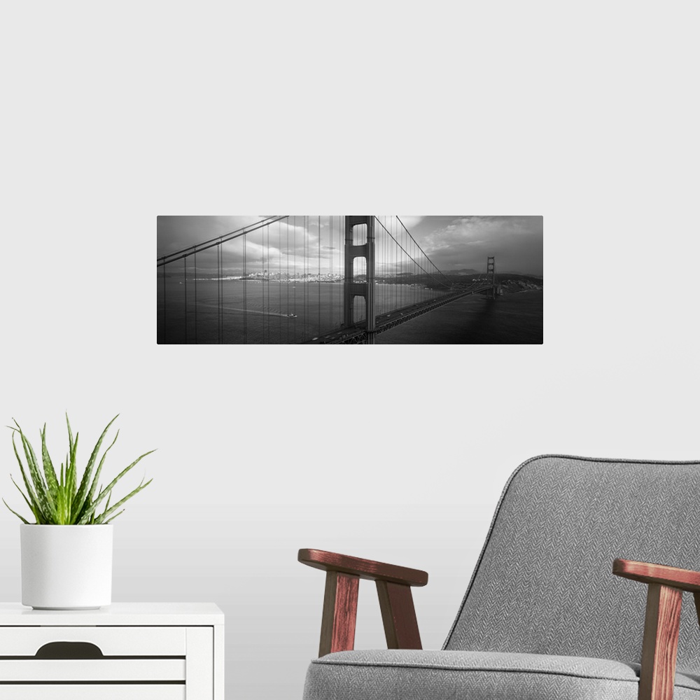 A modern room featuring Panoramic photo on canvas of the Golden Gate Bridge with the San Francisco cityscape in the dista...
