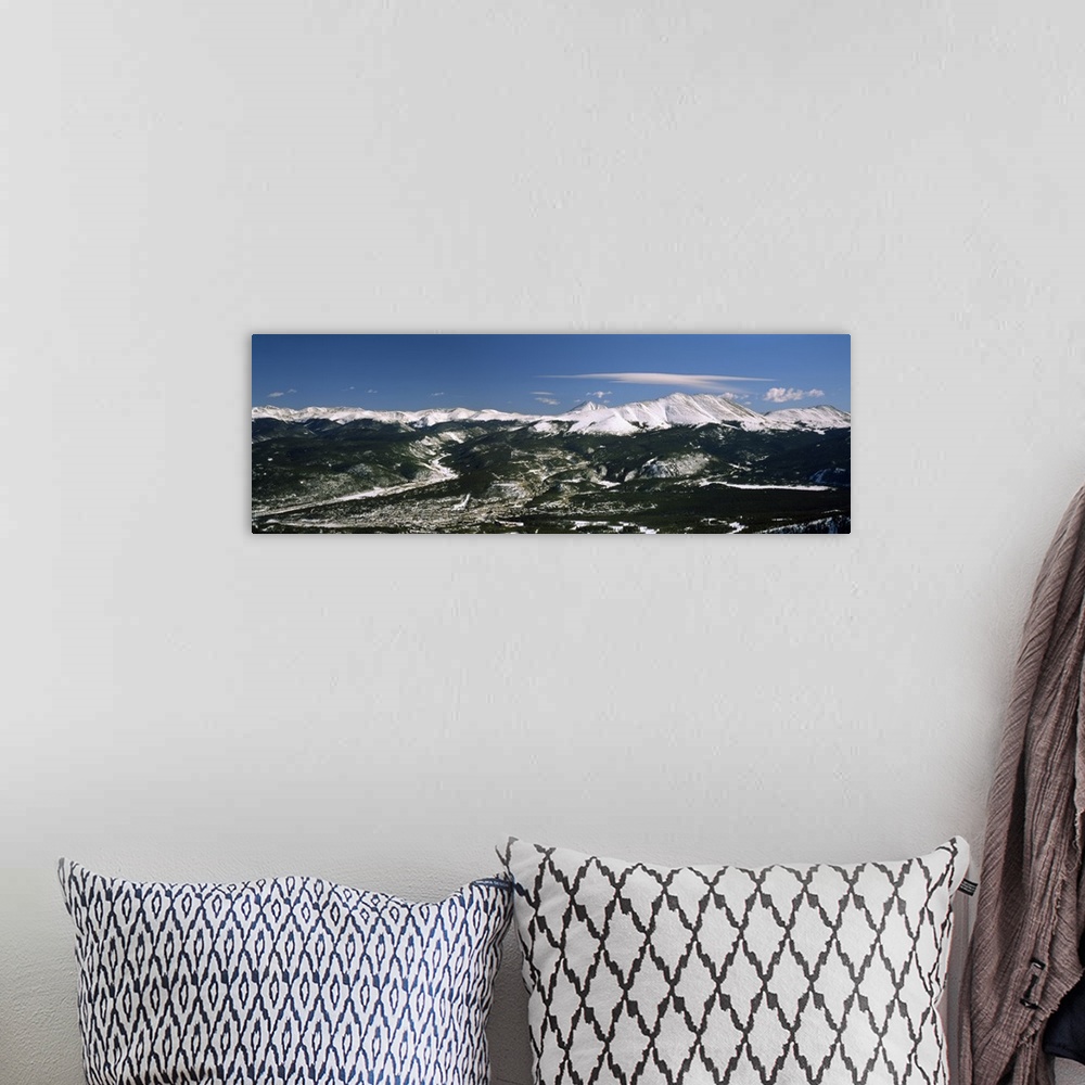 A bohemian room featuring This wide angle photograph is an aerial shot of a snow covered mountain range with vast land and ...