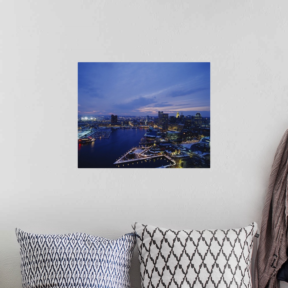 A bohemian room featuring Large photograph taken from an aerial view over the calm waters of the Inner Harbor within a busy...