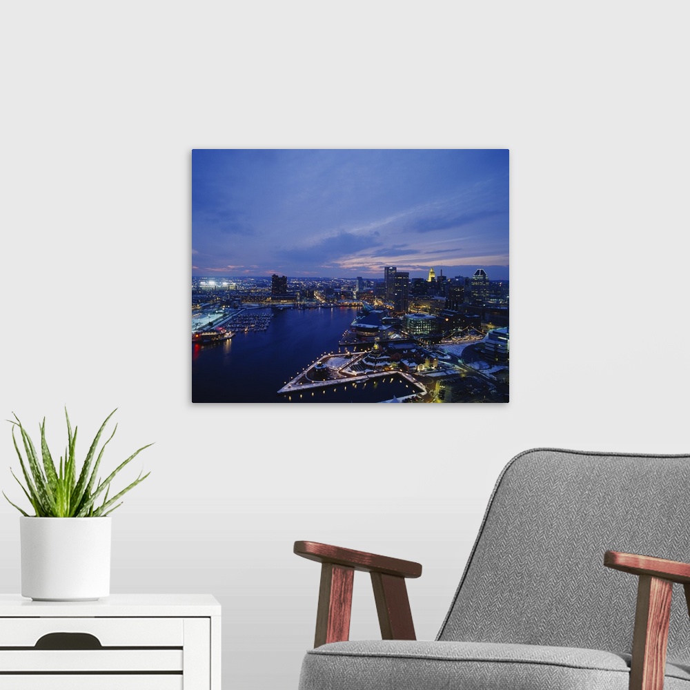 A modern room featuring Large photograph taken from an aerial view over the calm waters of the Inner Harbor within a busy...
