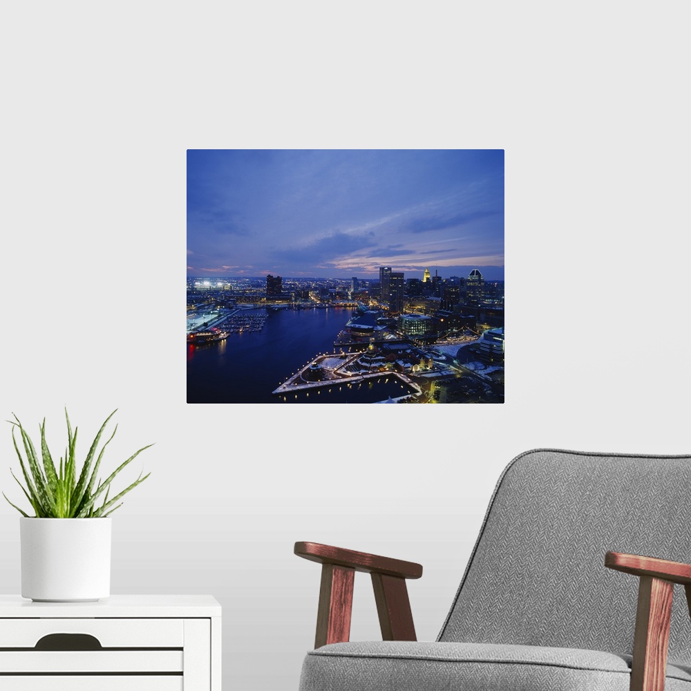 A modern room featuring Large photograph taken from an aerial view over the calm waters of the Inner Harbor within a busy...