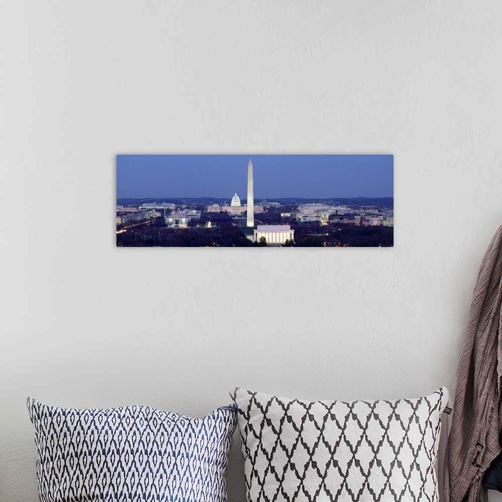 A bohemian room featuring Panoramic photograph of the United States capital at dusk, showing several landmarks including th...