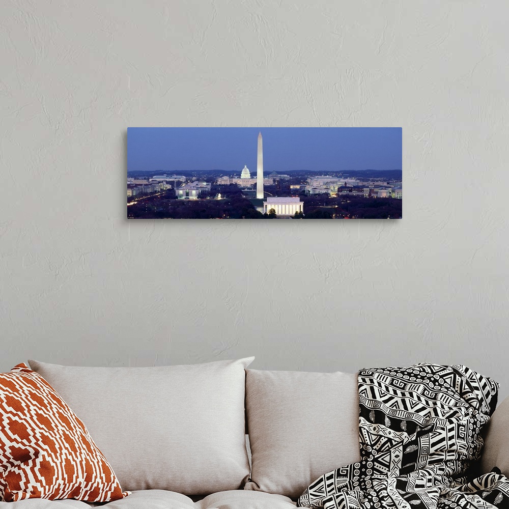 A bohemian room featuring Panoramic photograph of the United States capital at dusk, showing several landmarks including th...