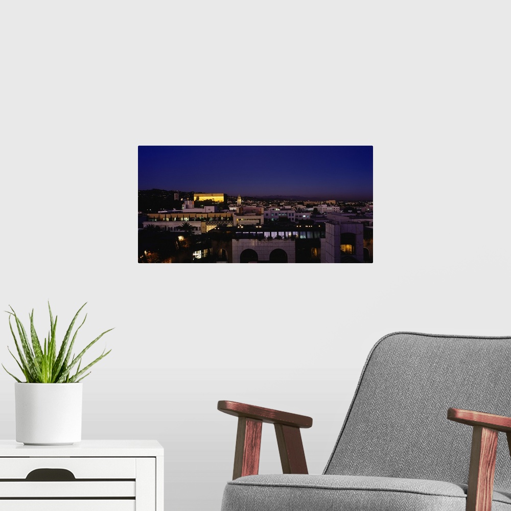 A modern room featuring High angle view of a cityscape with mountains in the background, Griffith Park Observatory, San G...