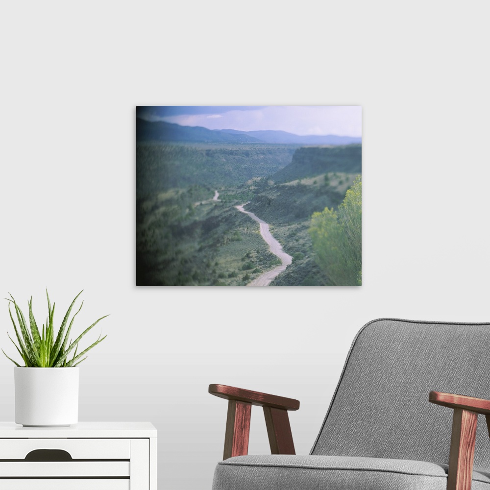 A modern room featuring High angle view of a dirt road passing through a valley, Rio Grande Gorge, Taos, Taos County, New...