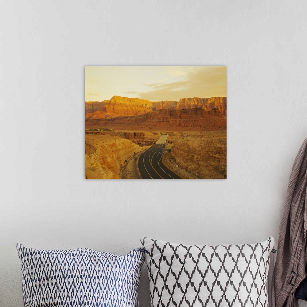 A bohemian room featuring This photograph is taken of a major highway that passes through the desert canyons in Arizona.