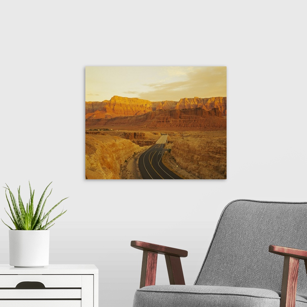 A modern room featuring This photograph is taken of a major highway that passes through the desert canyons in Arizona.