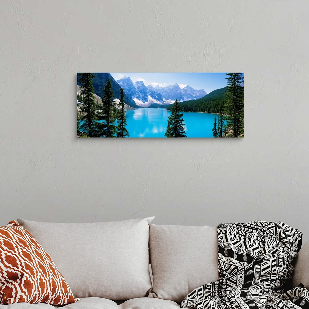 A bohemian room featuring Panoramic photograph of the Valley of Ten Peaks that is located on Moraine Lake within Banff Nati...