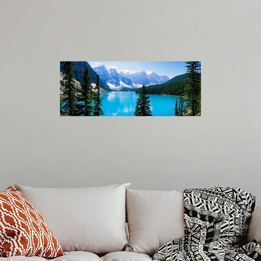 A bohemian room featuring Panoramic photograph of the Valley of Ten Peaks that is located on Moraine Lake within Banff Nati...