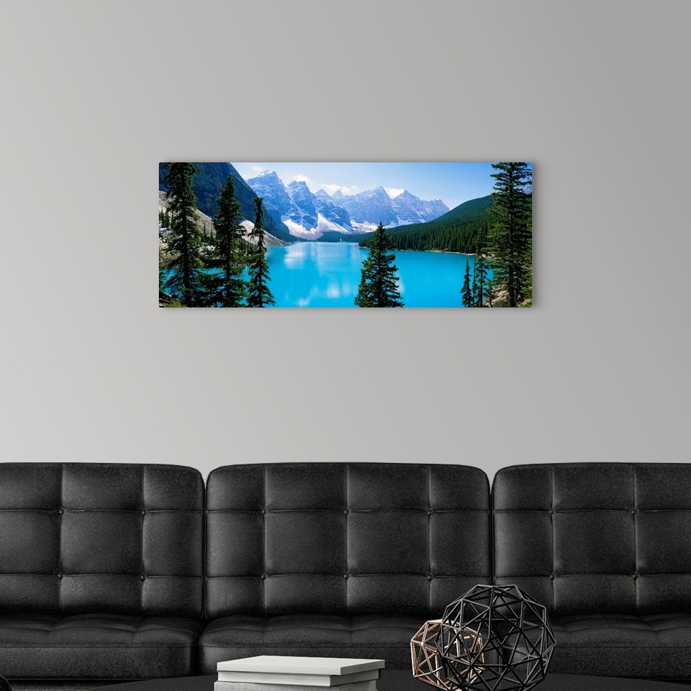 A modern room featuring Panoramic photograph of the Valley of Ten Peaks that is located on Moraine Lake within Banff Nati...