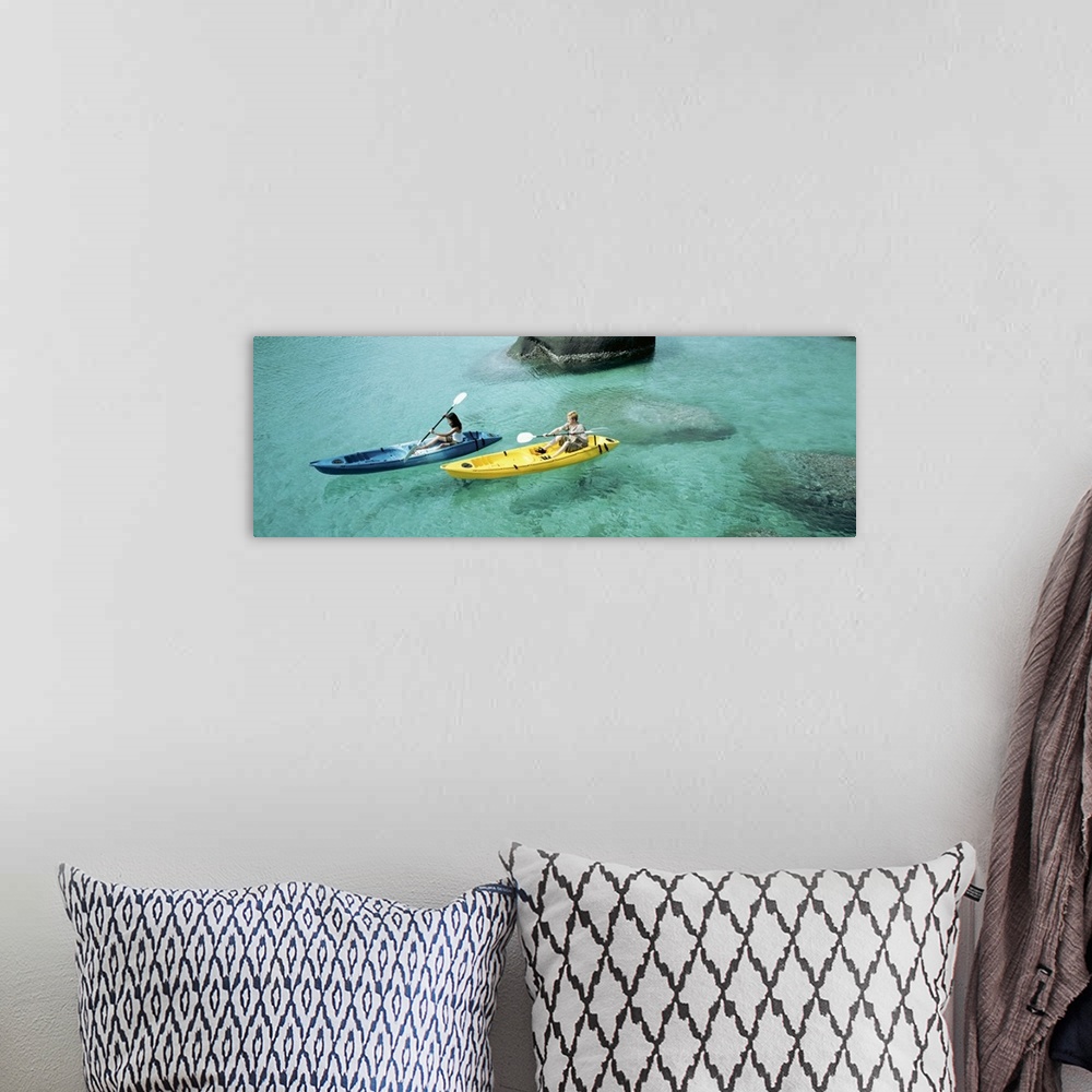 A bohemian room featuring High angle view of a man and a woman in a kayak