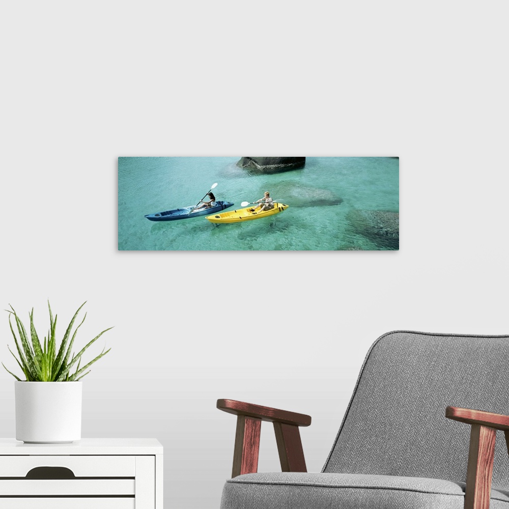 A modern room featuring High angle view of a man and a woman in a kayak