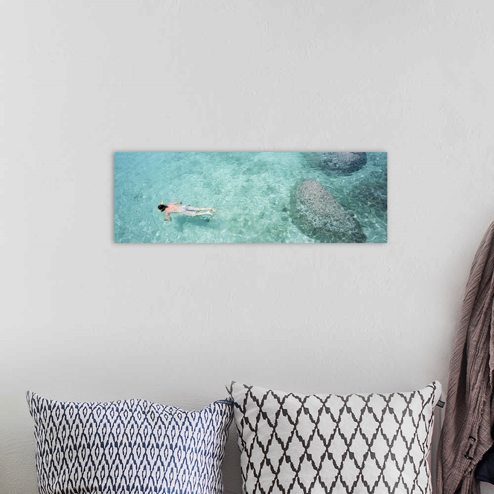 A bohemian room featuring High angle view of a man snorkeling