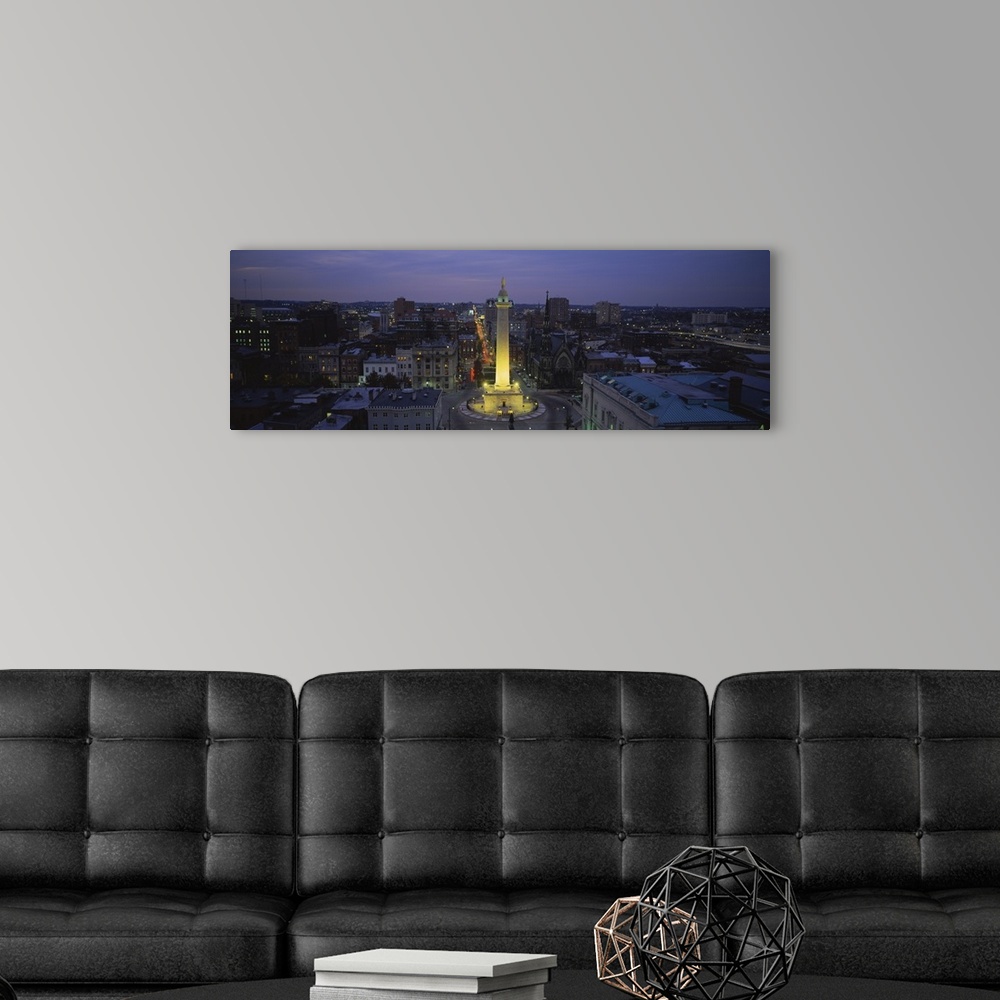 A modern room featuring View from above of the Washington Monument lit up in Baltimore, Maryland.