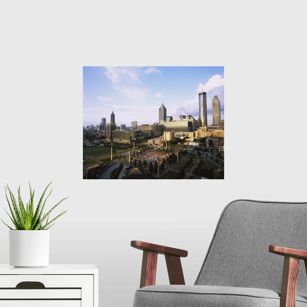 A modern room featuring Photo of Olympic Park with tall buildings in the background on canvas.