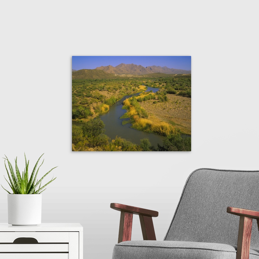 A modern room featuring High angle view of a river passing through a landscape, Verde River, Mazatzal Mountains, Tonto Na...