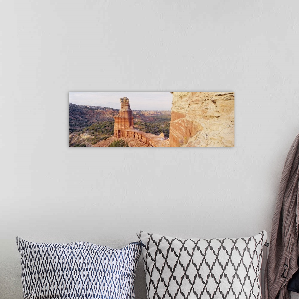A bohemian room featuring Long photo print of rock formations in the desert in Texas.