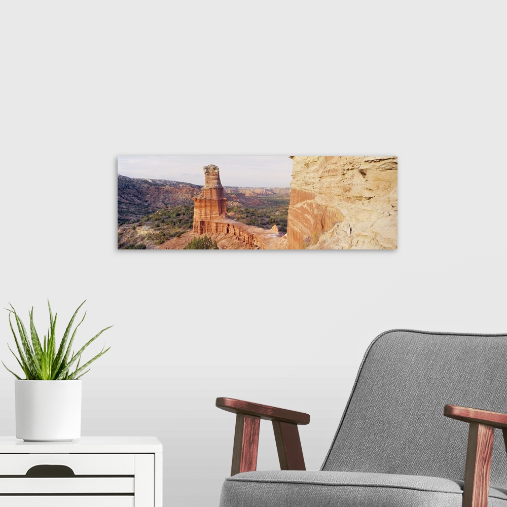 A modern room featuring Long photo print of rock formations in the desert in Texas.