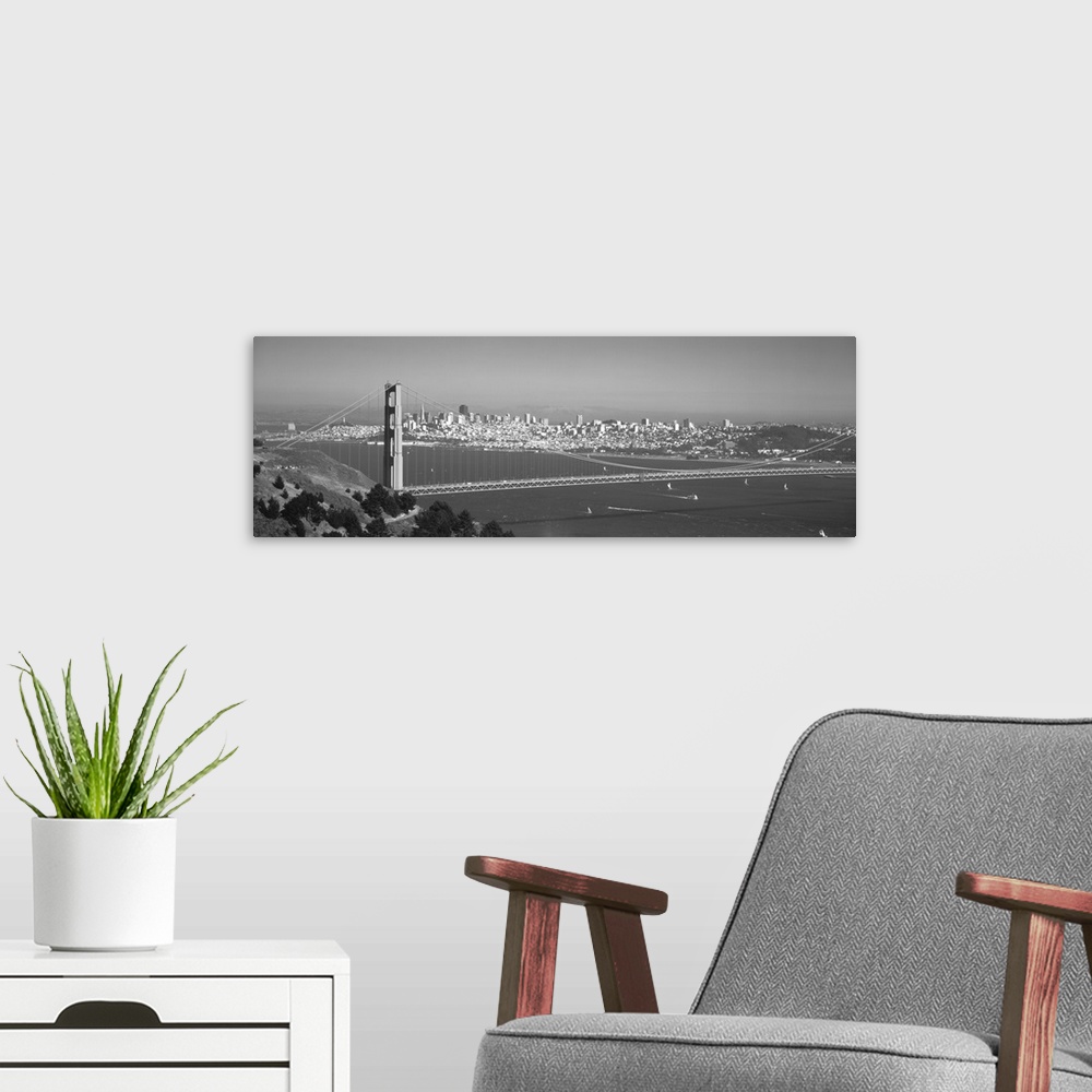 A modern room featuring Panoramic photograph of iconic west coast city overpass with city skyline in the distance on a fo...