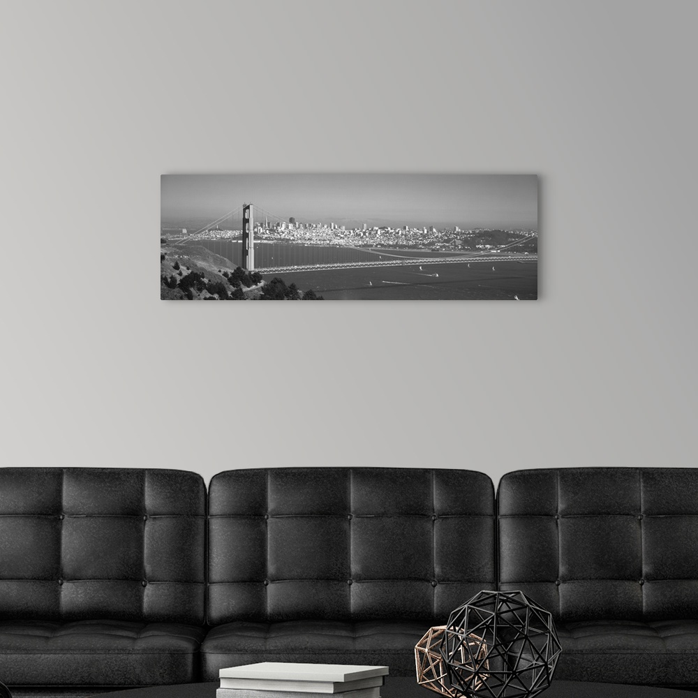 A modern room featuring Panoramic photograph of iconic west coast city overpass with city skyline in the distance on a fo...
