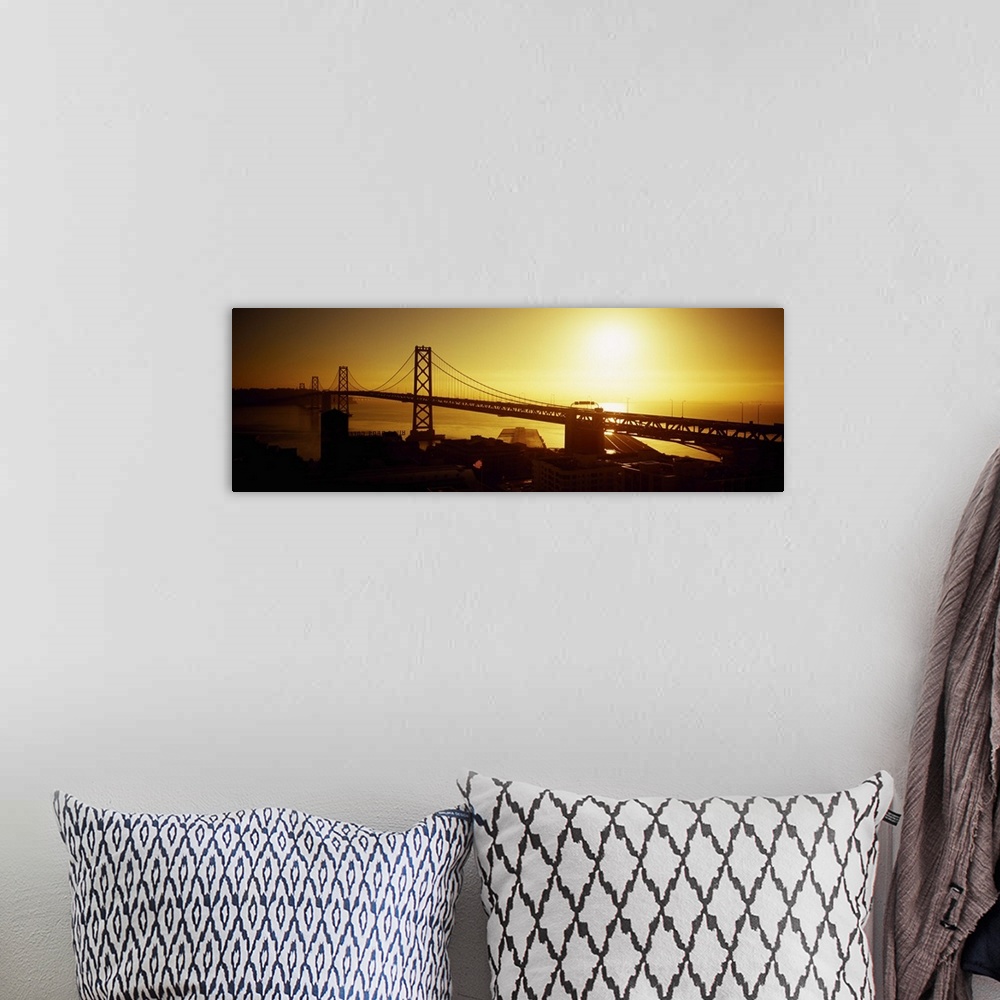 A bohemian room featuring High angle view of a suspension bridge at sunset, Bay Bridge, San Francisco, California
