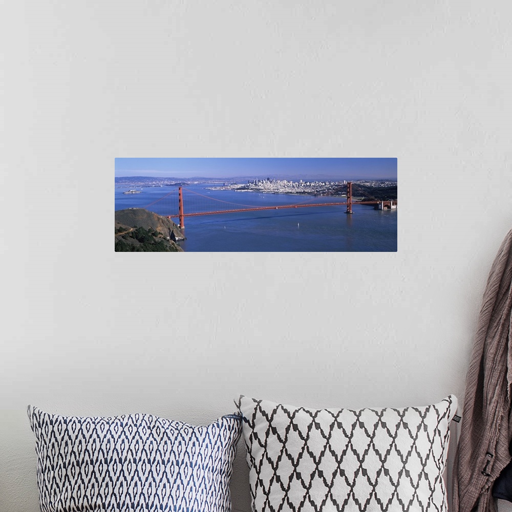 A bohemian room featuring Big art work for the home or office of the Golden Gate Bridge taken from afar with a large view o...