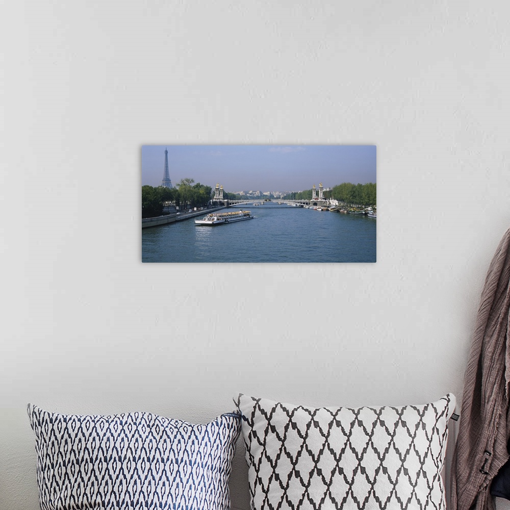 A bohemian room featuring High angle view of a tourboat in a river, Seine River, Paris, France