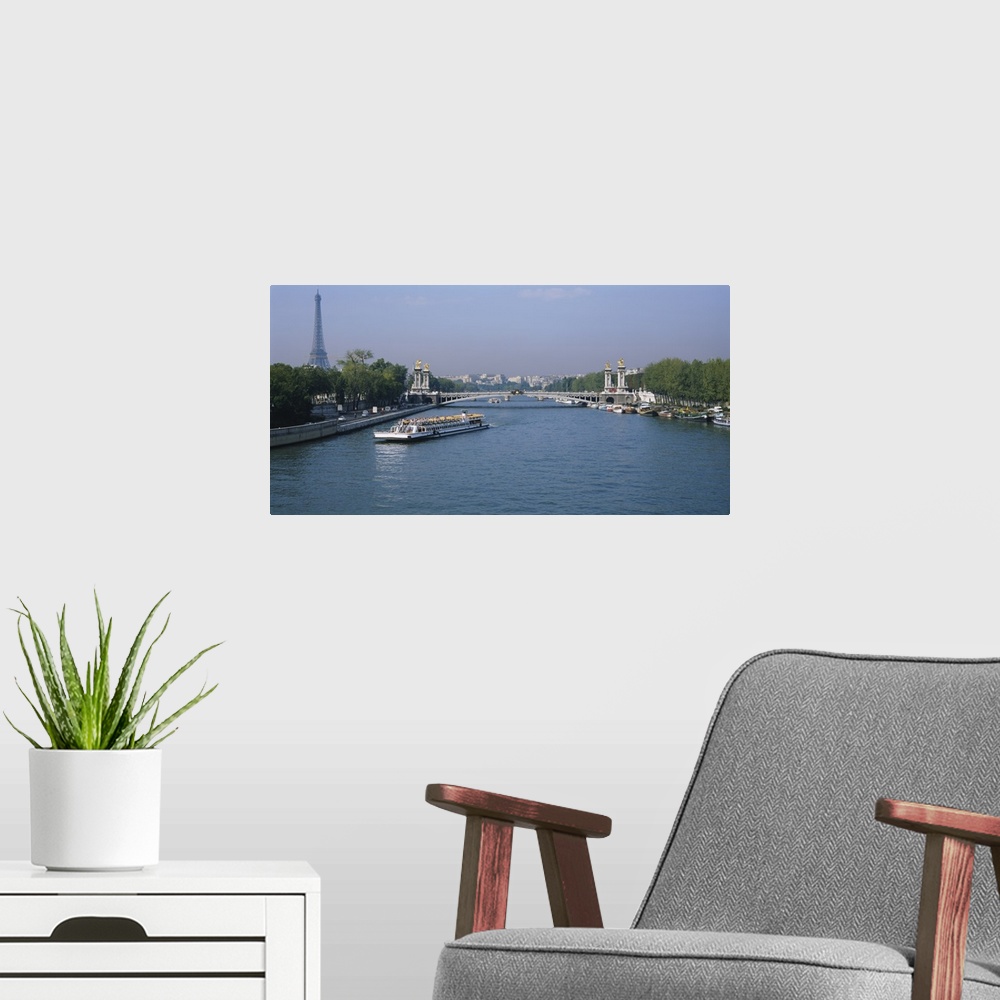 A modern room featuring High angle view of a tourboat in a river, Seine River, Paris, France
