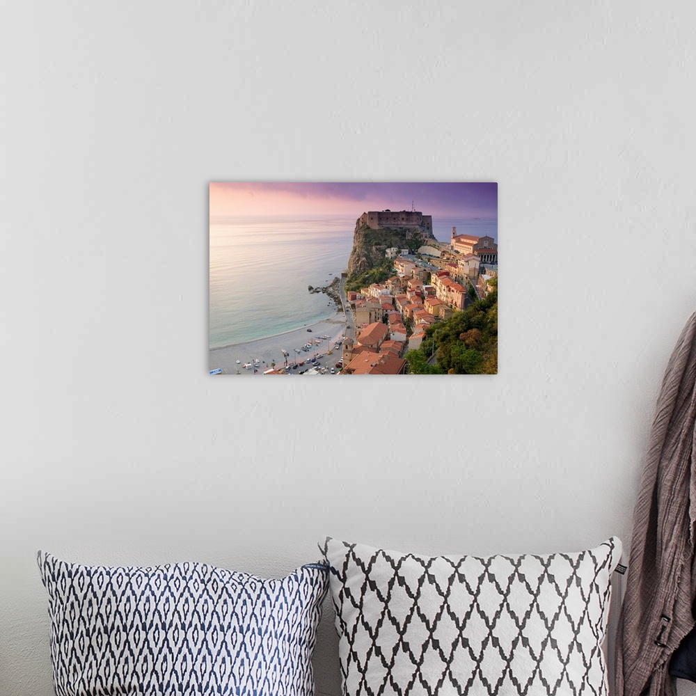 A bohemian room featuring Large photograph taken of a fortress on the edge of a cliff with houses and buildings nearby as t...