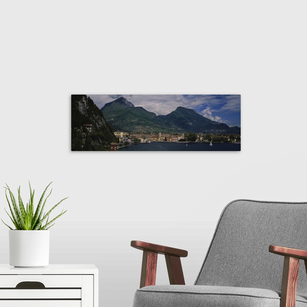 A modern room featuring High angle view of a town at the waterfront, Riva Del Garda, Italy
