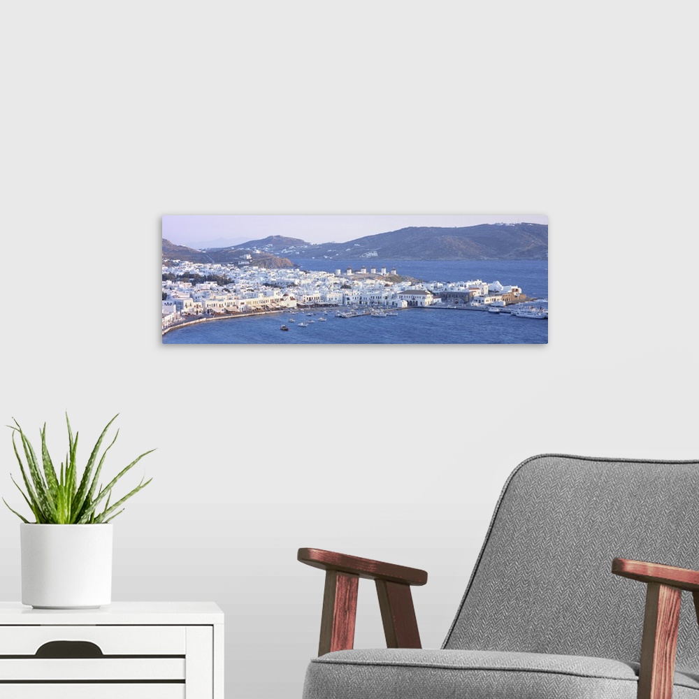 A modern room featuring High angle view of a town on the waterfront, Mykonos harbor, Cyclades Islands, Greece