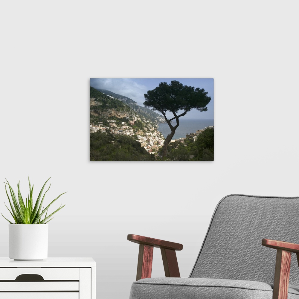 A modern room featuring Photo taken high up in the cliffs of the Amalfi Coast looking down at the light colored buildings...
