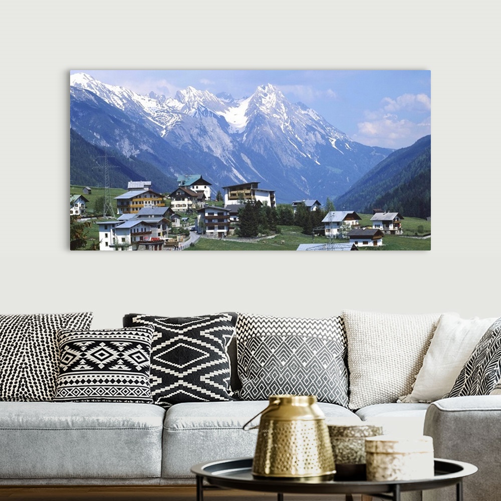 A bohemian room featuring High angle view of a village on a landscape and a mountain range in the background, St. Anton, Au...