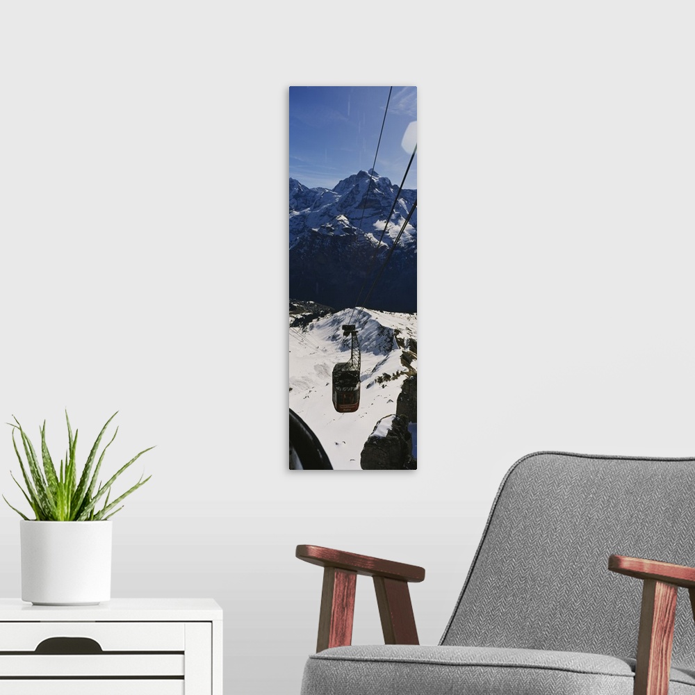 A modern room featuring High angle view of an overhead cable car, Jungfrau, Bernese Oberland, Swiss Alps, Switzerland