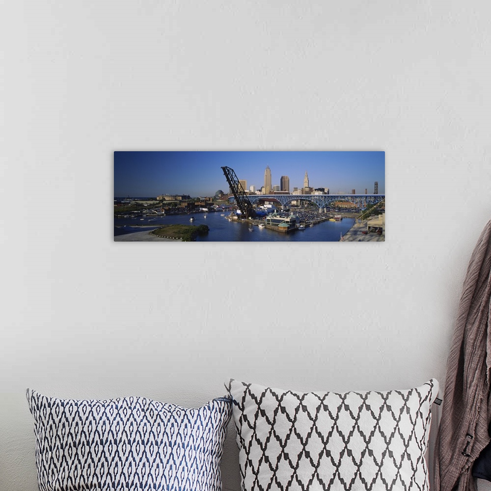 A bohemian room featuring Panoramic photograph of bridge with port and sailboats below with skyline in the distance under a...
